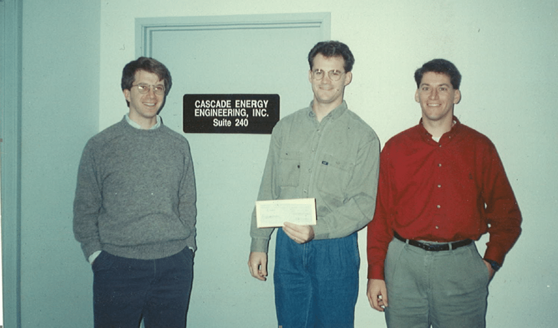 picture of Cascade Energy founders in front of their very first office in 1993