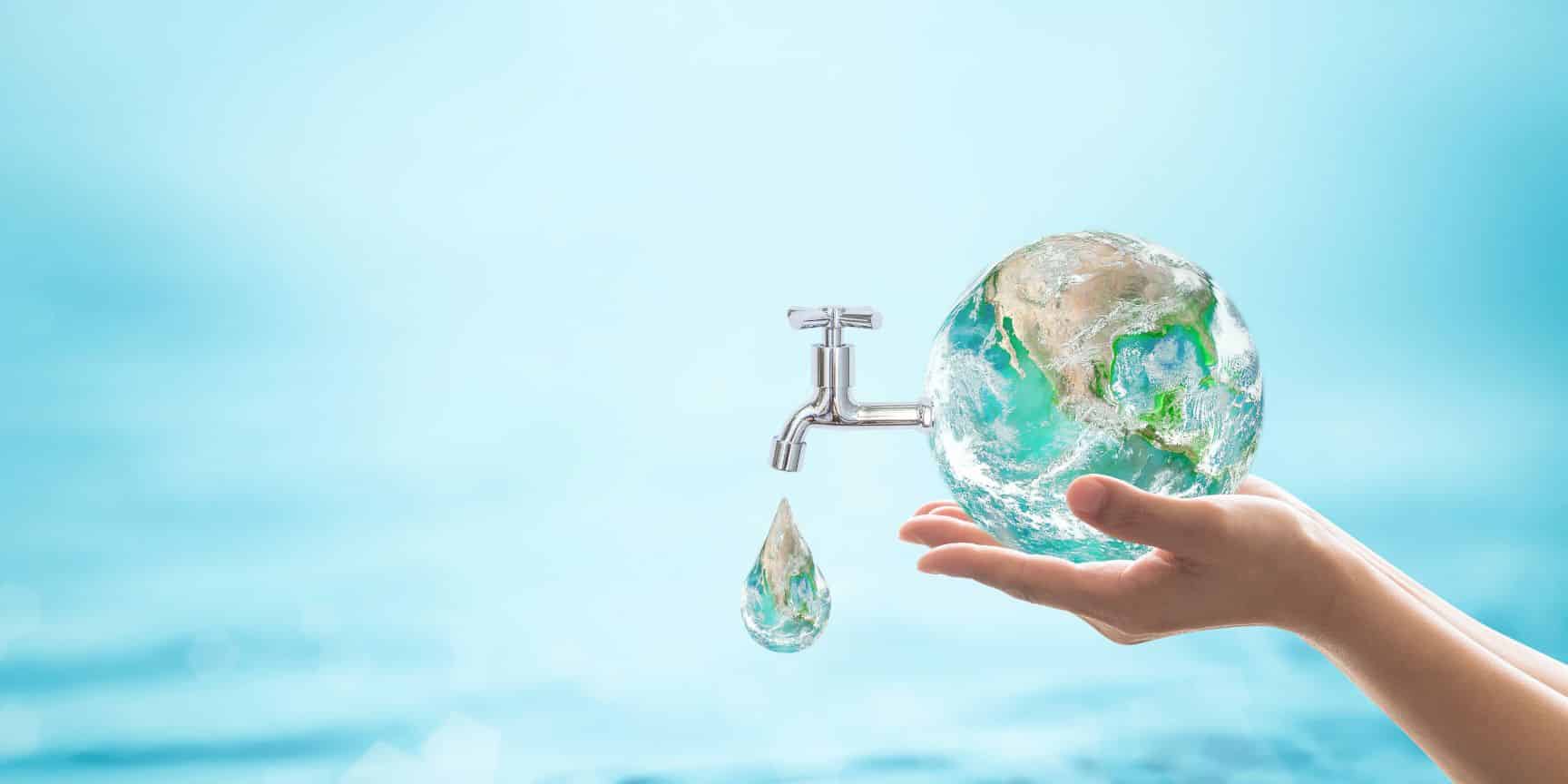 Hands holding small globe of water
